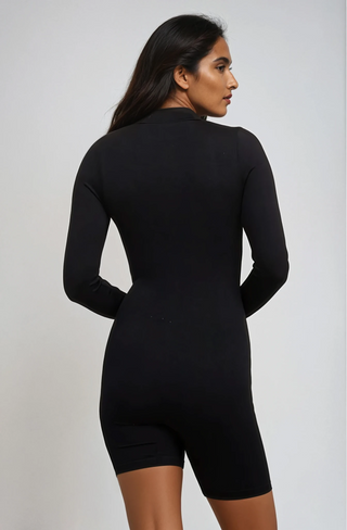 Black long sleeve zip front romper.