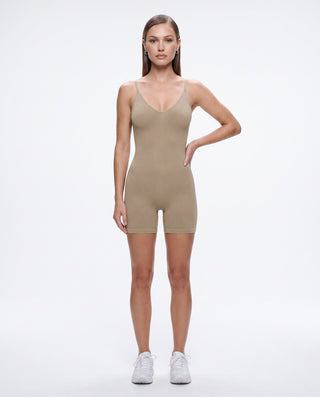 Women’s taupe ribbed seamless romper with V-neckline, spaghetti straps and fitted biker shorts, a neutral one-piece for athleisure, travel, errands and casual everyday outfits.