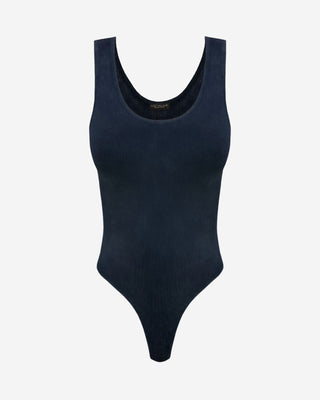 A navy blue, dye washed, ribbed fabric bodysuit with a round neckline and smooth, buttery feel.