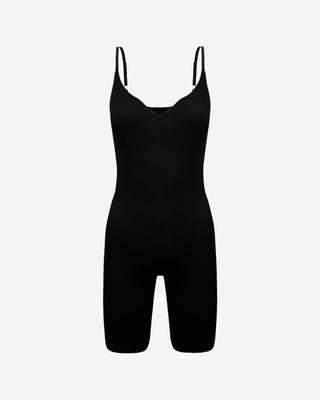 Black ribbed spaghetti strap romper with V-neckline and fitted biker shorts, a versatile women’s one-piece for layering, athleisure, travel, casual wear and everyday styling.