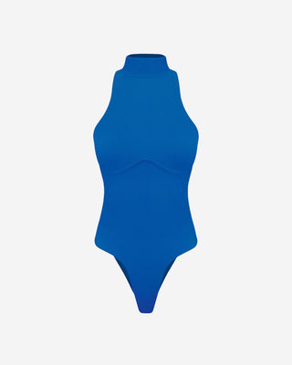 Blue ribbed mock neck bodysuit with a sleeveless mock neck design, body contouring fit, and underbust contour seam for elevated women's fashion