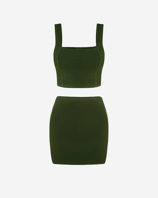 Front view of the women’s two-piece set, featuring a structured crop top with wide straps and a matching fitted mini skirt.