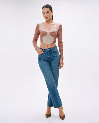 Women’s rust and cream fitted long sleeve crop top with colorblock cutout design, paired with denim and heels for an elevated casual, date night, and going-out look