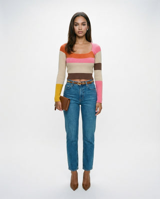 Women’s long sleeve ribbed knit crop top with a square neckline and multicolor stripe design, styled on a model against a white studio background.