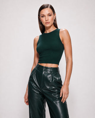 Dark green fitted ribbed crop tank top paired with high-waisted faux leather pants, a chic women’s top for nightlife, dinner, weekend and city outfits.