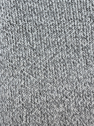 Close-up of textured gray fabric on women’s sleeveless longline duster vest, showcasing premium woven texture and sophisticated fall layering style.