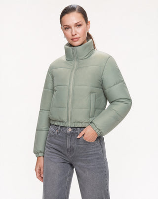 Women's sage green quilted puffer coat featuring a cropped silhouette, full zip closure, high neck, long sleeves, and soft insulated padding for fall and winter layering