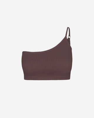 A one-shoulder bralette in a brown color, with a ribbed texture and thick straps.