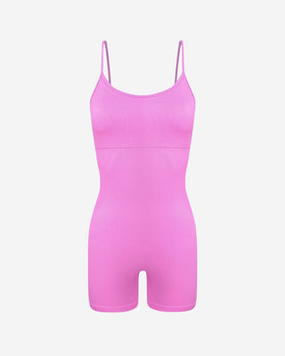 Front view of a pink women’s fitted romper highlighting slim straps, scoop neckline, contoured silhouette, and mid-thigh length.