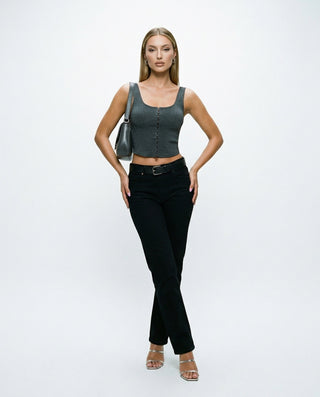 Women’s fitted corset-style crop top with wide shoulder straps and front hook-and-eye closure, styled on a model against a white studio background.