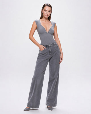 Women’s gray deep V-neck fitted top styled with wide-leg jeans and heels, a chic elevated casual outfit for everyday wear, brunch, date night, and going out