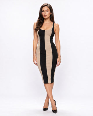Women’s fitted black and beige striped midi dress with wide straps and scoop neckline, styled with black pumps for dinner dates, cocktail events, parties and sophisticated city nights.