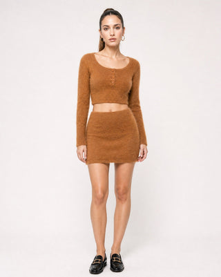 Women’s camel brown fuzzy knit matching set with long sleeve cropped henley top and mini skirt, styled with black loafers for a cozy chic fall outfit, brunch look and elevated everyday style.