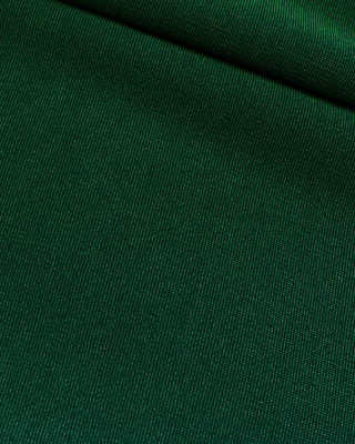 A forest green feathered mini dress with a tube fit and a hidden zipper at the back with hook and eye closure.