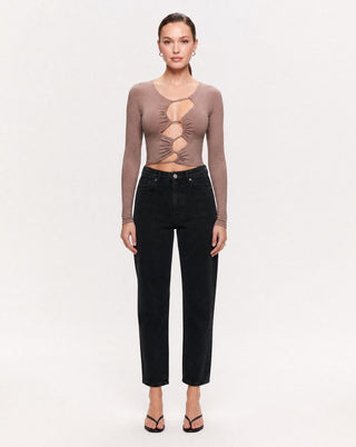Women's brown long sleeve cutout crop top with ruched front detailing, styled with black high waisted jeans and heels for a chic date night, girls' night out, dinner, or elevated casual outfit.