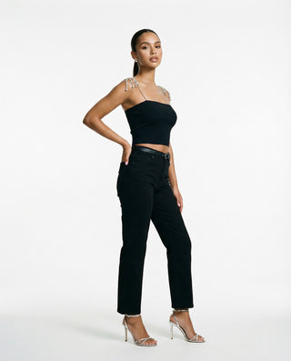Women’s crystal chain strap crop top styled on a model, featuring a fitted silhouette and embellished shoulder straps against a white studio background.