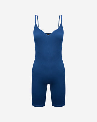 Blue ribbed sleeveless romper with V-neckline, spaghetti straps and fitted biker shorts, a versatile women’s one-piece for layering, athleisure, travel, lounging and everyday wear.