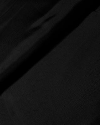 Interior detail of the skirt displaying a smooth, lightweight lining designed for comfortable wear and clean structure.