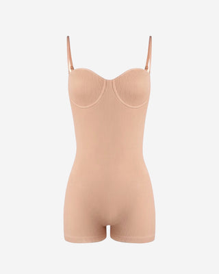 Buff beige ribbed romper for women featuring adjustable straps, supportive contour cup design, stretch knit fabric, and a sleek body-contouring silhouette with fitted shorts
