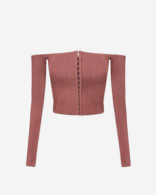 Dusty rose ribbed corset crop top with an off-the-shoulder neckline, long sleeves, contour seams, and hook-and-eye front fastening