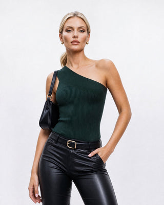 Women’s dark green ribbed one-shoulder crop top with asymmetrical neckline, fitted silhouette, styled with black leather pants