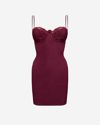 Dark red strappy mini dress with lace cups and rose detail in center.