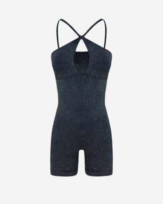 Black acid wash ribbed romper featuring a halter neck design, chest cutout, soft stretch knit material, and figure-flattering silhouette