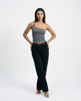 One-shoulder ribbed crop top for women featuring an asymmetrical neckline, fitted silhouette, and stretch knit fabric, styled on a model against a white studio background.