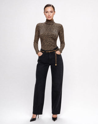 Women's leopard print long sleeve mock neck top paired with black denim, featuring a fitted silhouette and classic animal print design