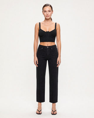 Women's black underwire ribbed crop top with wide straps and a sculpting fit paired with black straight leg jeans for a sleek minimalist outfit