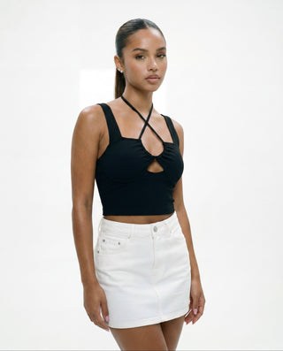 Women's black ribbed crop top with crossover halter neckline, front cutout detail, contour seams, and supportive fitted design for day-to-night styling