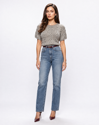 Women’s gray cable knit short sleeve sweater with crystal embellishments, styled with straight leg jeans and burgundy heels for a chic fall outfit, elevated casual wear and day-to-night style.