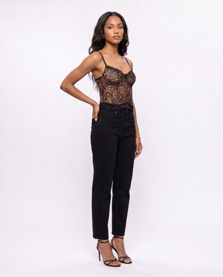 Women’s leopard print sheer mesh corset top with black lace trim, styled with black high-waisted jeans and heels for date night, girls’ night, cocktails and going-out looks.